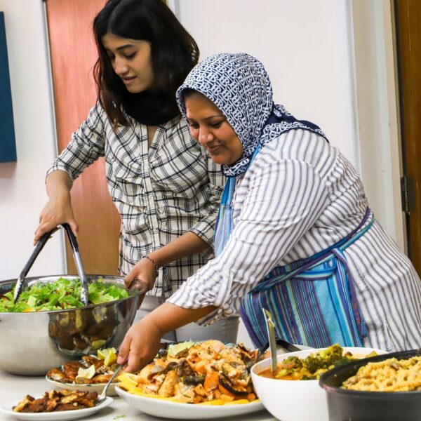 People cooking together at West London Welcome