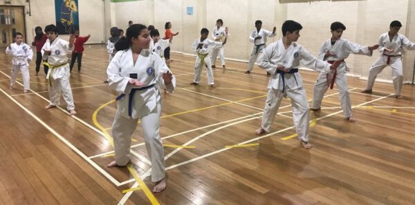 Young people taking part in a taekwondo class