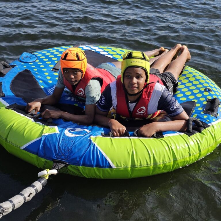 Two boys on a floatie