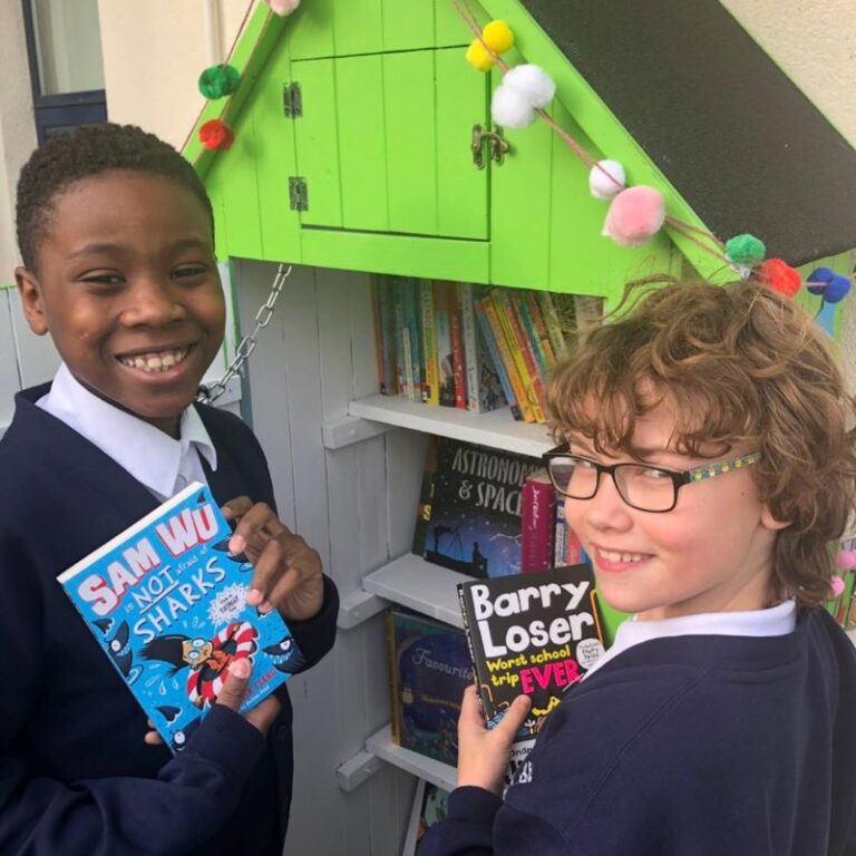 Two children choosing their gifted books.