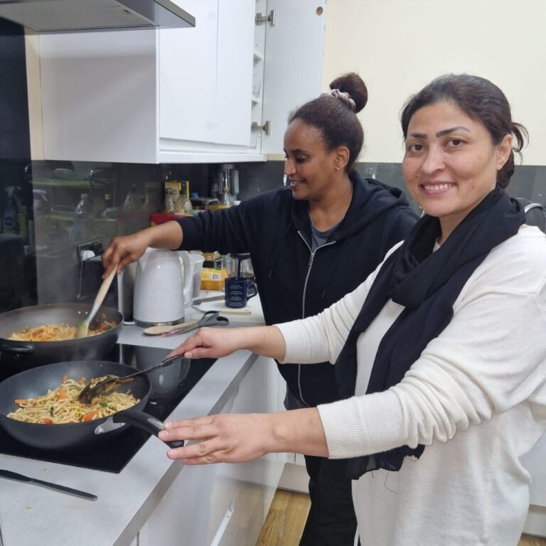 Two women cooking together