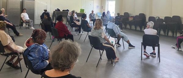 People doing chair-based exercises