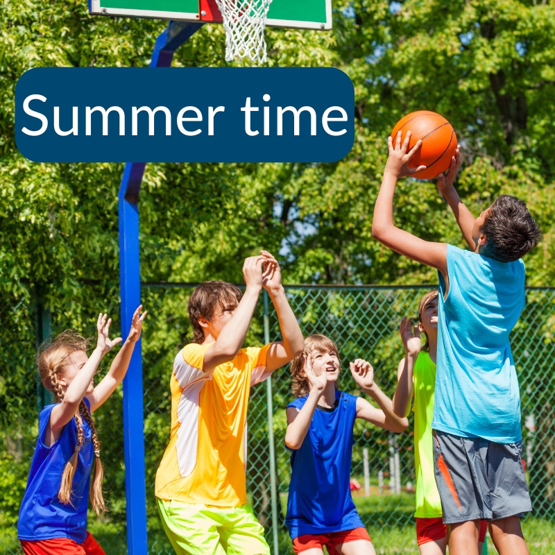 Teenagers playing basketball